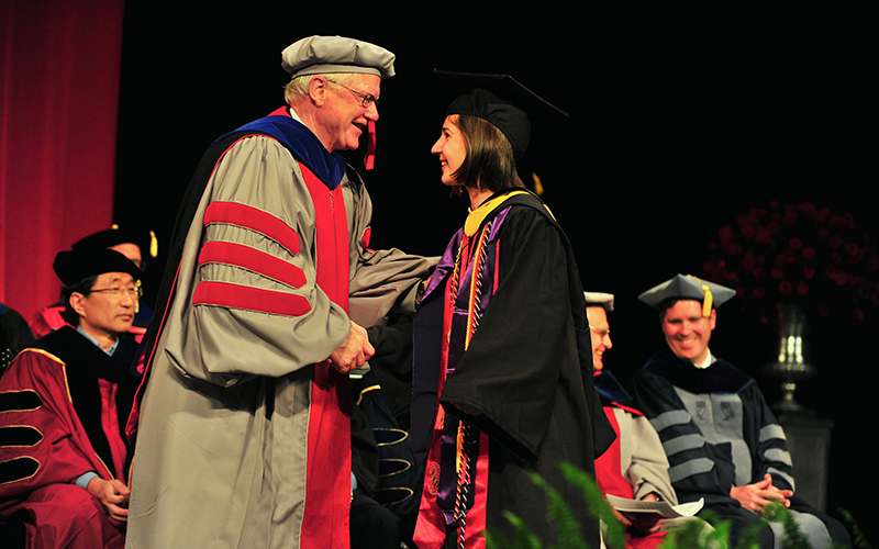 Female student accepts diploma Female student accepts diploma
